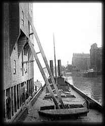 Unloading grain from a freighter.